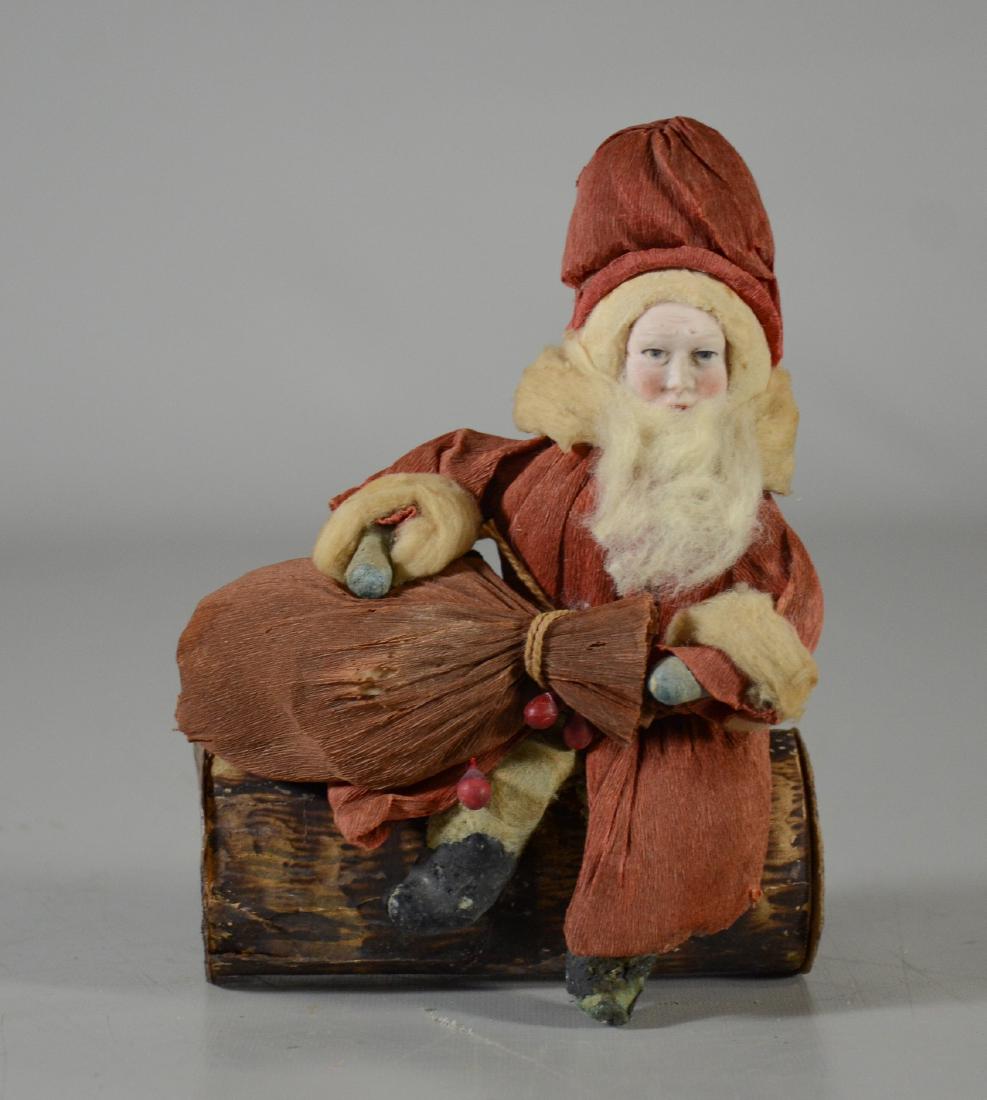 Heubach Santa Claus on log candy container, crepe (1 of 4)
