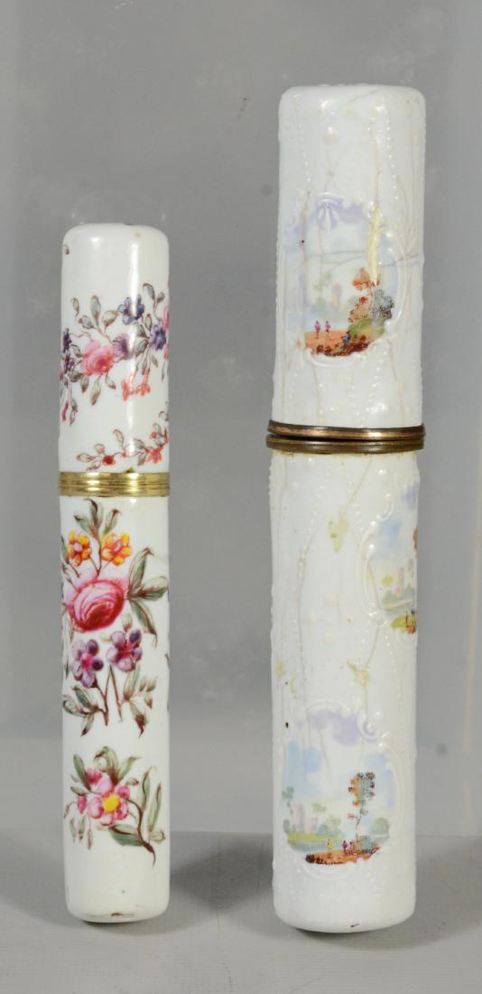 (2) Battersea Bilston English enamel needle cases: (2) Battersea Bilston English enamel needle cases bodkins, the largest 5", painted with pastoral scenes, some cracking to enamel, the smallest painted with flowers, good condition