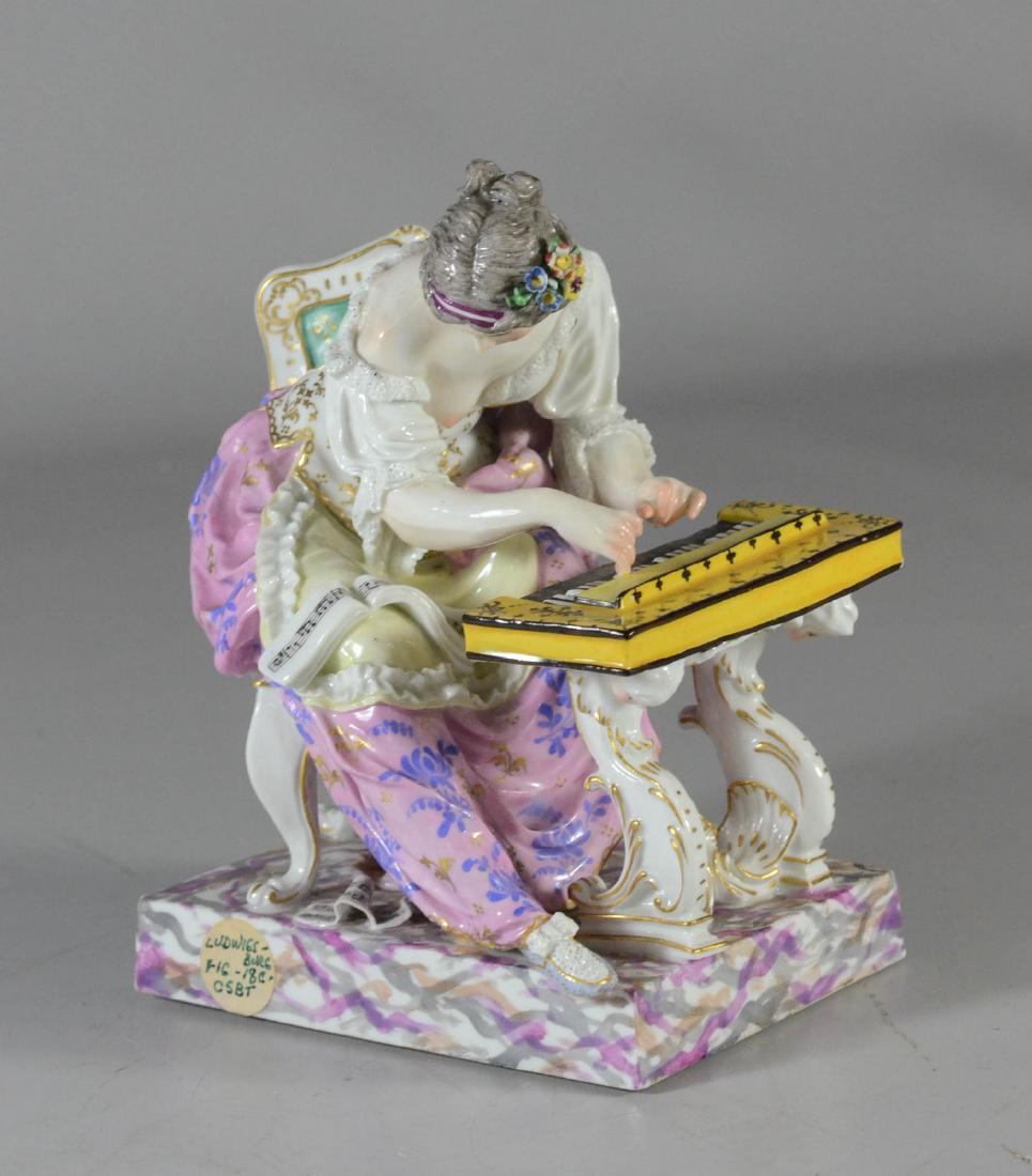 Ludwigsburg figure of a pianist, late 19th C: Ludwigsburg figure of a pianist, late 19th C, modeled as a lady seated at a keyboard, with underglaze blue crossed double 'C' mark and decorator's monogram. H: 6-3/4 inches