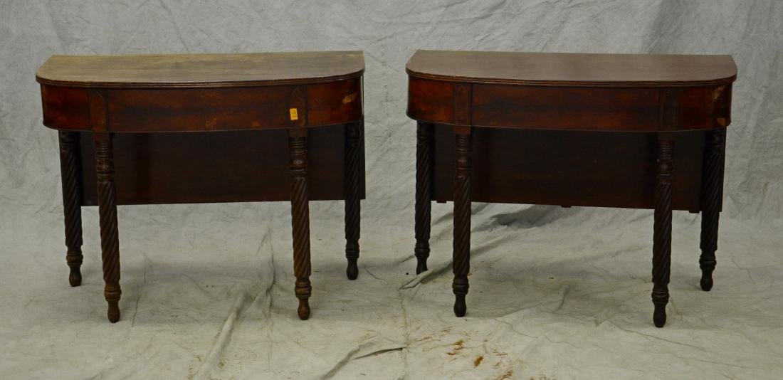Pr American Empire Mahogany drop leaf console tables: Pr American Empire Mahogany drop leaf console tables with rope turned legs, flame grain mahogany; 19th Century; each measures 28 1/2" high, by 37" wide, by 19" deep; poor condition, veneer damages and