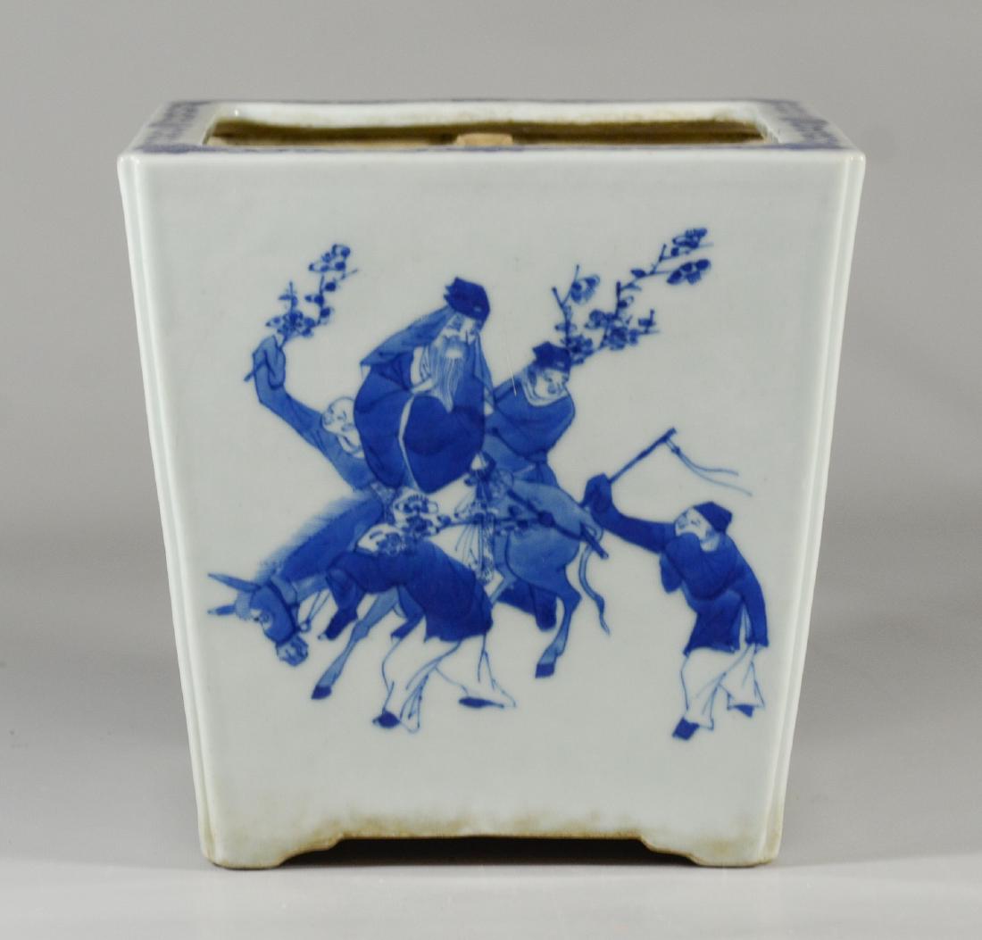 Blue & white Chinese porcelain planter: Blue & white Chinese porcelain planter, each side with figural genre decoration, 7 3/8" h, 7 1/2" sq, 19th c, hairline crack at base near man astride horse; another hairline at base near scholars at d