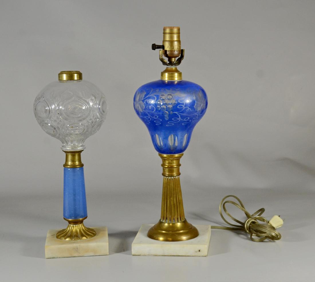 2 Oil lamps to include a clear glass with blue stem, (1 of 1)