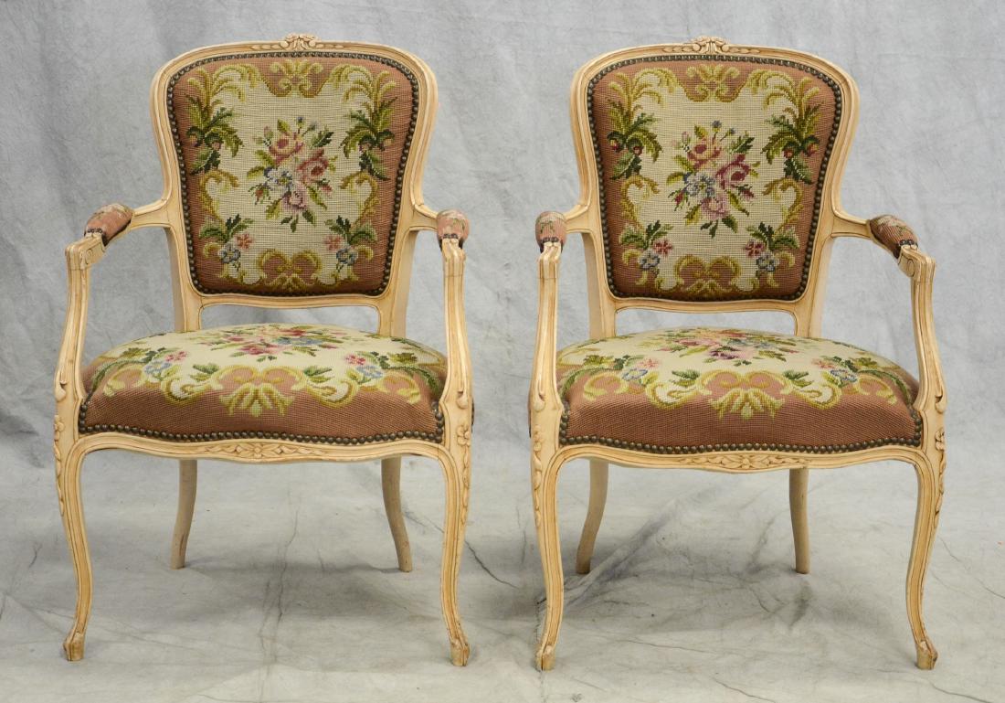 Pair distressed cream painted needlepoint fauteuils,: Pair distressed cream painted needlepoint fauteuils, floral needlepoint upholstery, distressed cream painted carved frames, light wear to paint, wear to needlepoint, 34"h x 23"w x 23"d