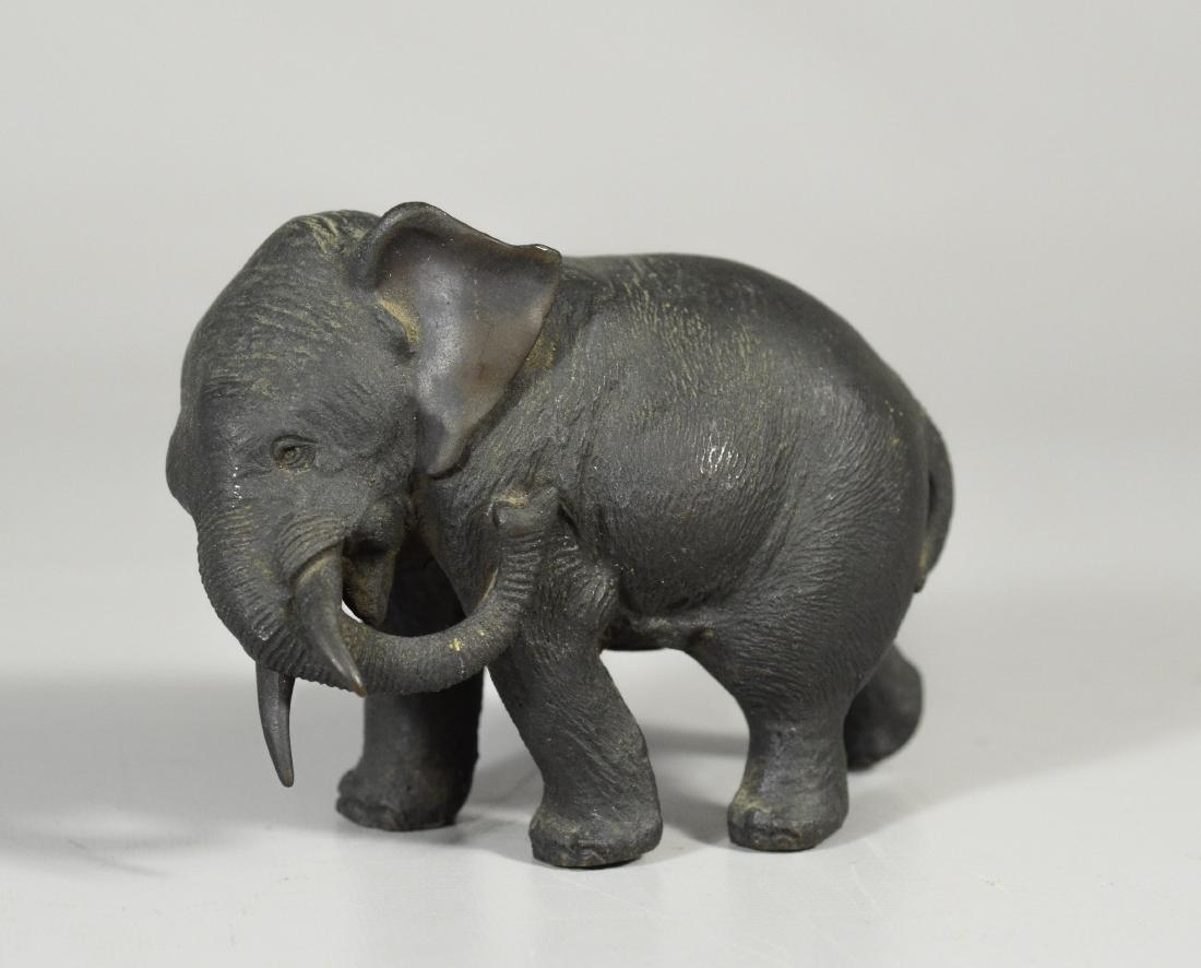 Japanese bronze of an elephant, trunk by his side (1 of 4)