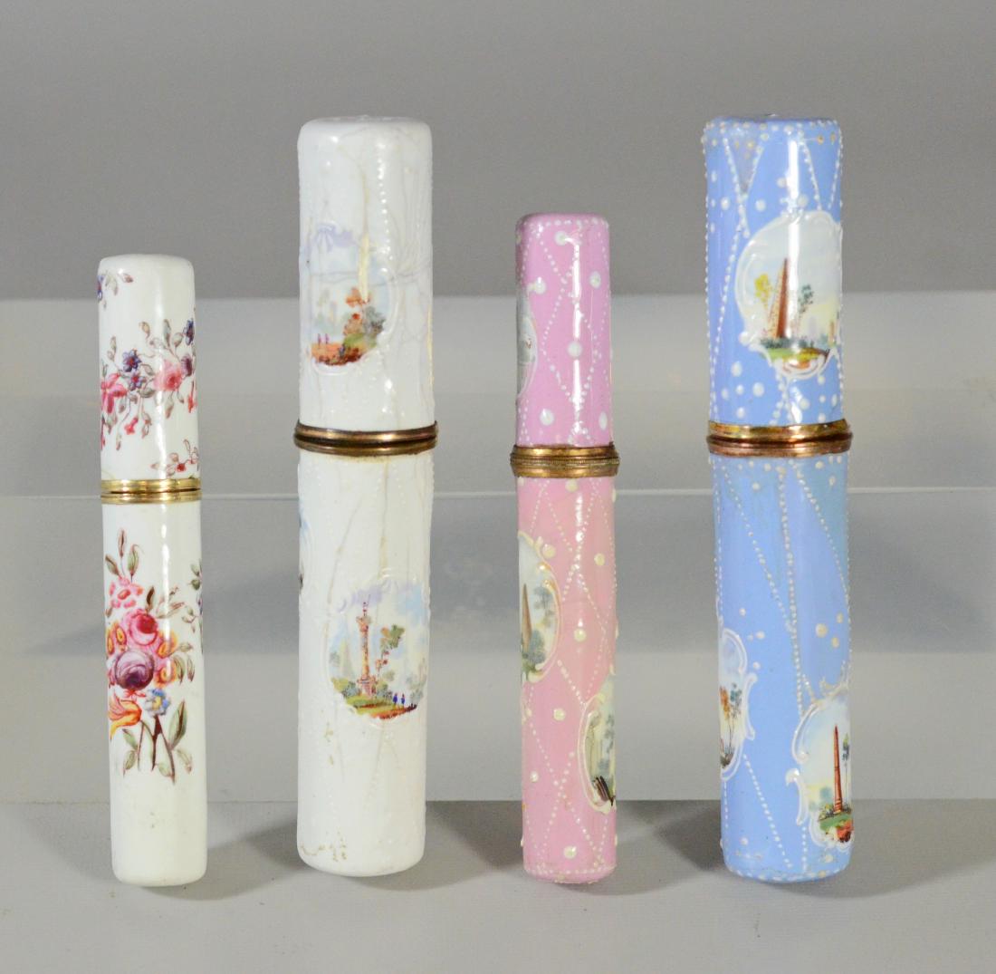 (4) Battersea Bilston English enamel needle cases: (4) Battersea Bilston English enamel needle/bodkin cases, both painted with pastoral scenes, longest 5", minor wear to base of pink case, painted with pastoral scenes, some cracking to enamel, the sma
