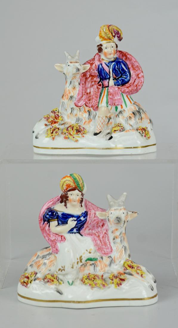 Pr English Staffordshire figures, each astride goat (1 of 2)
