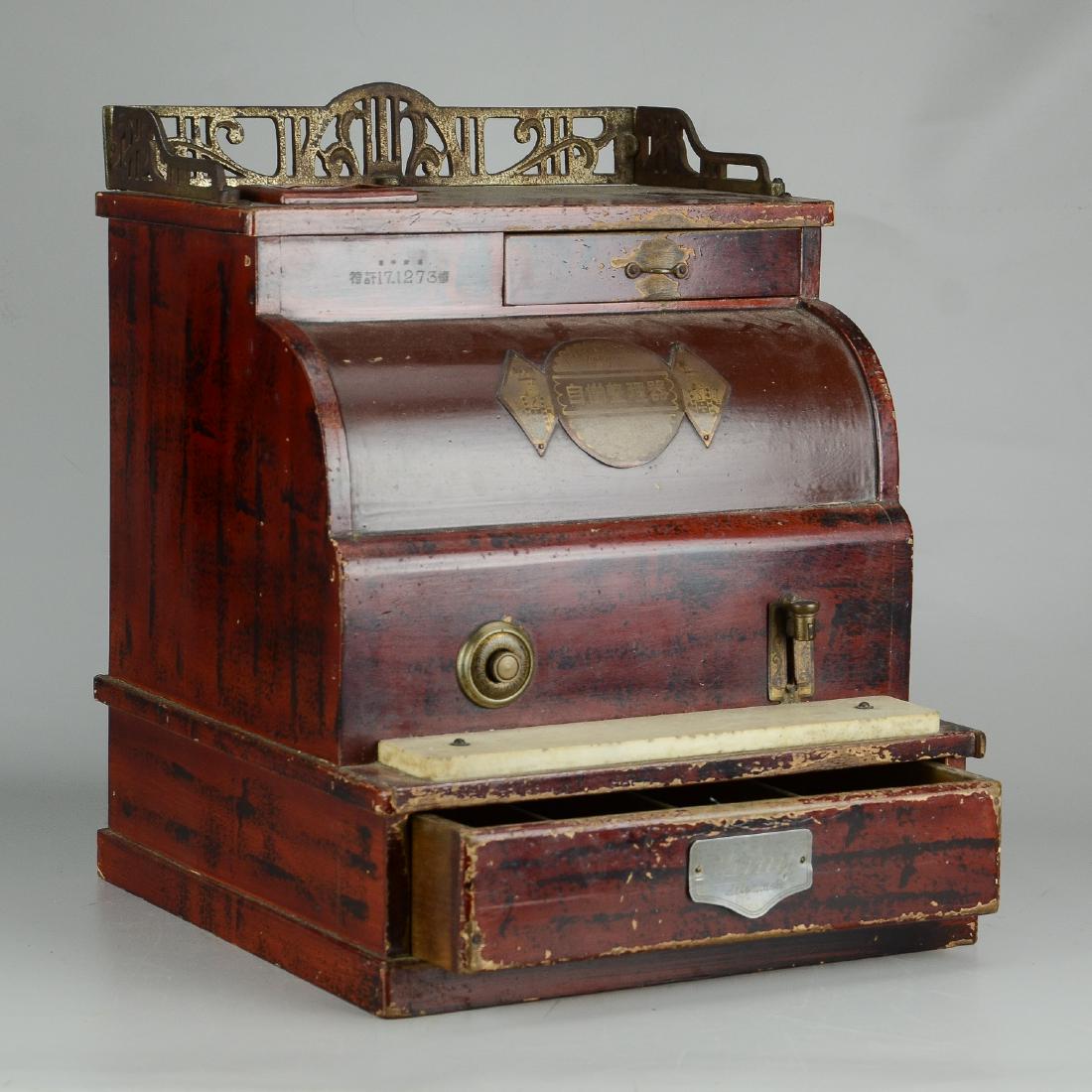Cash Register: King wood cash register, metal gallery, metal name plate signed with calligraphy, made in Tokyo, red faux graining, 13-3/4" w x 13-1/2" d x 17-1/2" h, wear to finish