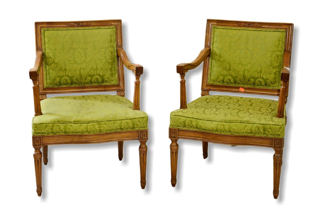 Pair walnut Louis XV style armchairs: Pair walnut Louis XV style armchairs, square backs with floral decorated crest, scalloped arms over columned posts, green damask upholstery, rosettes over tapered and reeded legs, 31"h x 22"w x 20"d