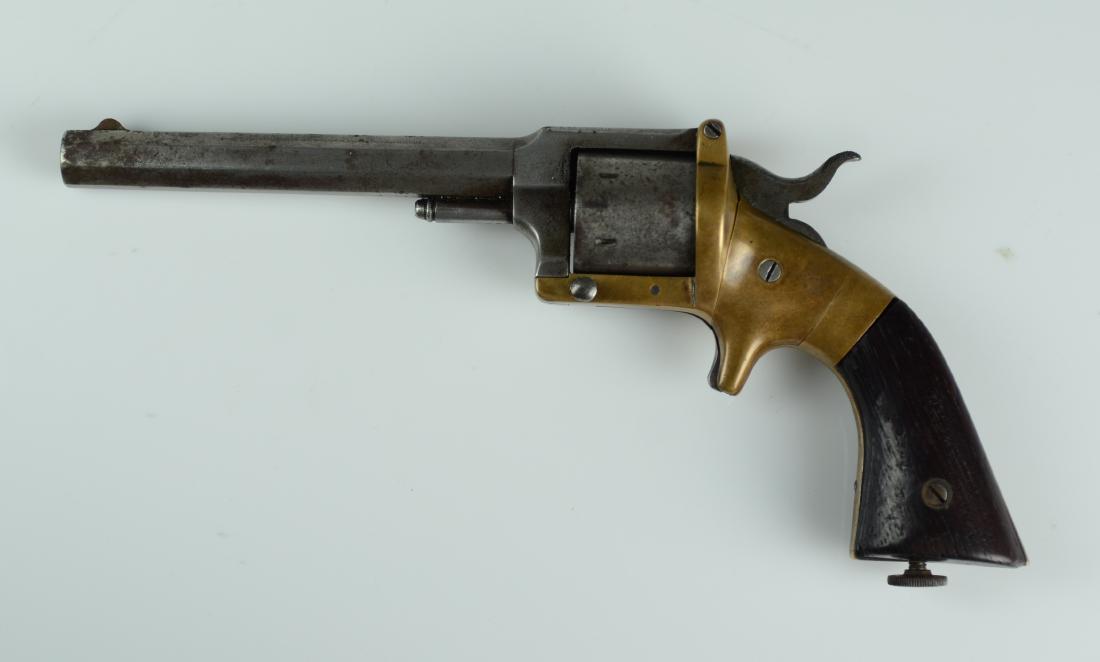 Lucius W Pond 32 cal pocket revolver: Lucius W Pond 32 cal pocket revolver, brass frame, 5" barrel, made c 1861-1870, SN 522, top of octagon barrel marked "LW Pond / Worcester / Mass / Patented July 10, 1860". Smith and Wesson sued Pond f