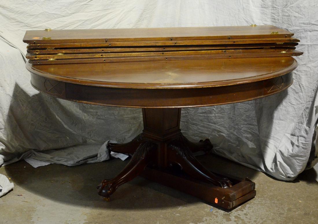 Mahogany Colonial Revival Round Pedestal Dining Table: Carved Mahogany Colonial Revival Round Pedestal Dining Table, Molded Edge Top Over A Plain Veneered Apron, 60" Dia., Over Square Tapered Pedestal Base, On 4 Legs With Acanthus Carved Leaves And Ball A