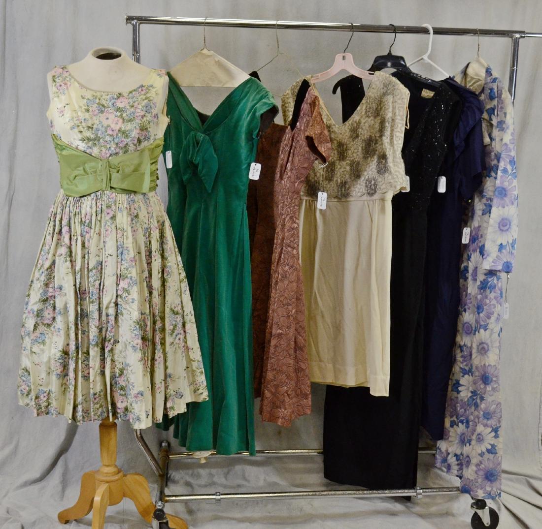 1950S/60S Designer Dress Grouping: 7 Designer Dresses To Include A 1950'S Emerald Green Velvet Kay Selig, A Floral Jacquard 1950'S Party Dress, A Floral 1950'S Elinor Gay Dress With Green Sash, A 1960'S Cream Beaded Shift Dress, A 1950