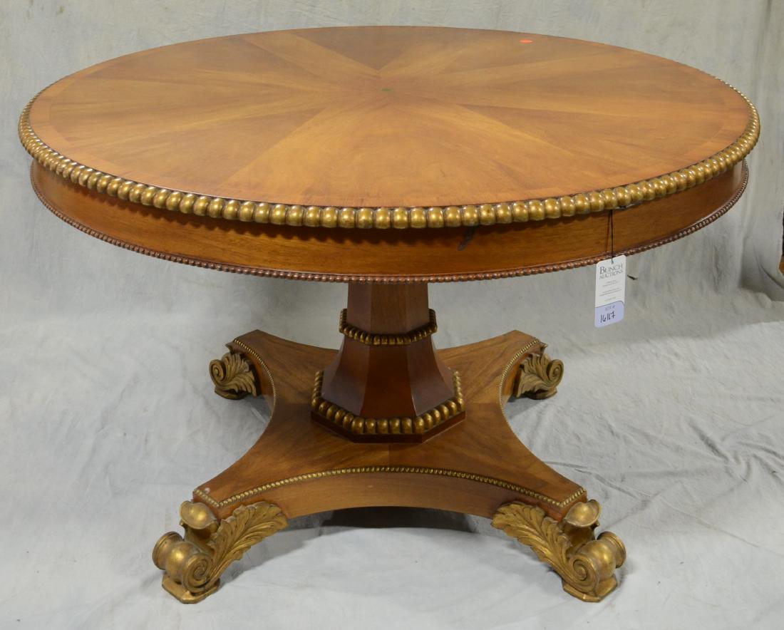 Empire style round dining table: Empire style round dining table, gilt highlight around border, pedestal with gilt acanthus leaves around scrolled feet, 56" diameter