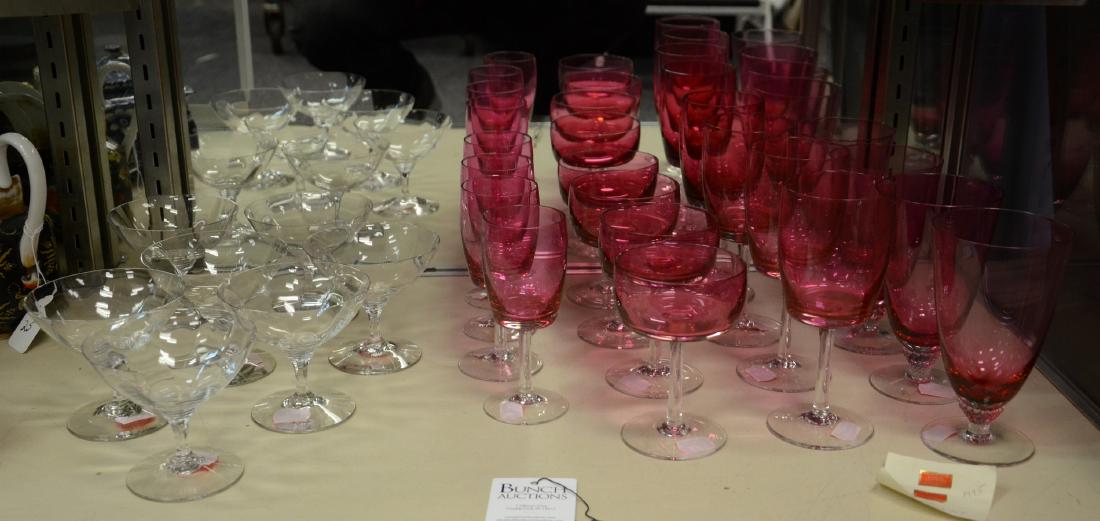 Shelf #5 - (23) Pcs Crystal Stemware: Shelf #5 - (23) Pcs crystal stemware, c/o Gorham Reizart handblown cranberry pink & clear stems (4 each water goblets, champagne saucers, white wine & red wine glasses), and 7 clear optic sherbets