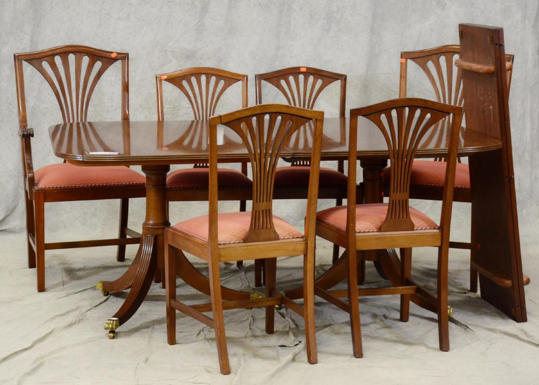(7) pc Mahogany Chippendale style dining room set: (7) pc Mahogany Chippendale style dining room set, c/o 4 side chairs with 2 armchairs, double pedestal base with brass claw feet, 29-1/2"w x 70"w x 24"d with 2 18"w boards