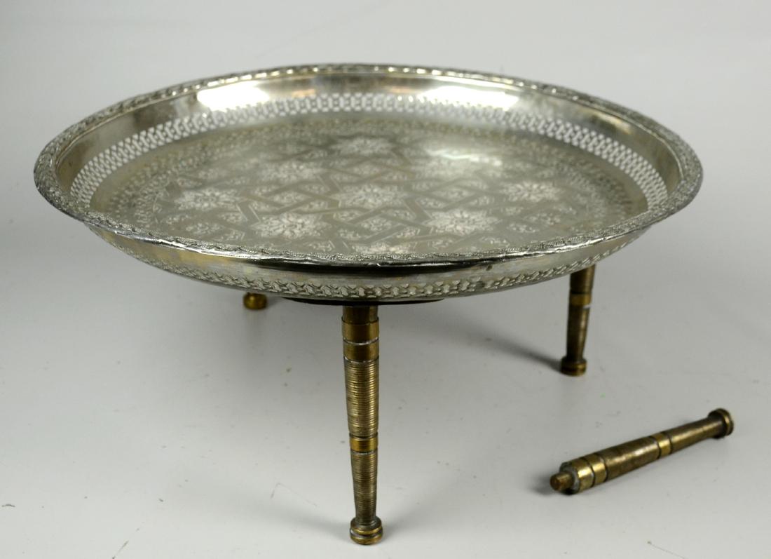 Silver Plate Tray Table: Silver plated tray table with brass legs, engraved center with geometric Arabic design, pierced sides, leaf form edge, 18-1/4" dia x 8-1/4" h
