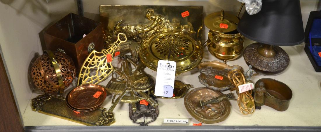 Shelf #25 - Metal Lot, Brass, Copper, Bronze: Shelf #25 - Metal lot, including brass: Cape Cod lighter, pot pourri, woman milking goat plaque, door push, leaf dish, iron trivet, hunting & fishing plaque, horsehead wall hook, bell, embossed table