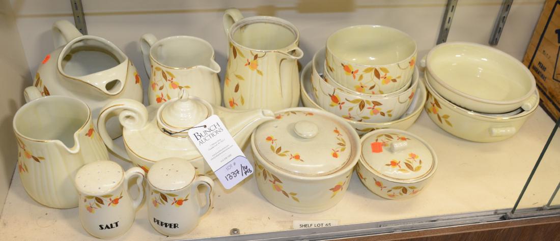 Shelf #65- (16) Pcs Hall's Superior Ironstone Serveware: Shelf #65 - (16) Pcs Hall's Superior Ironstone Serveware, yellow and orange floral pattern, c/o (1) genie style teapot, (4) pitchers, pr handled salt and pepper shakers, (1) 6-3/4" covered round bowl,