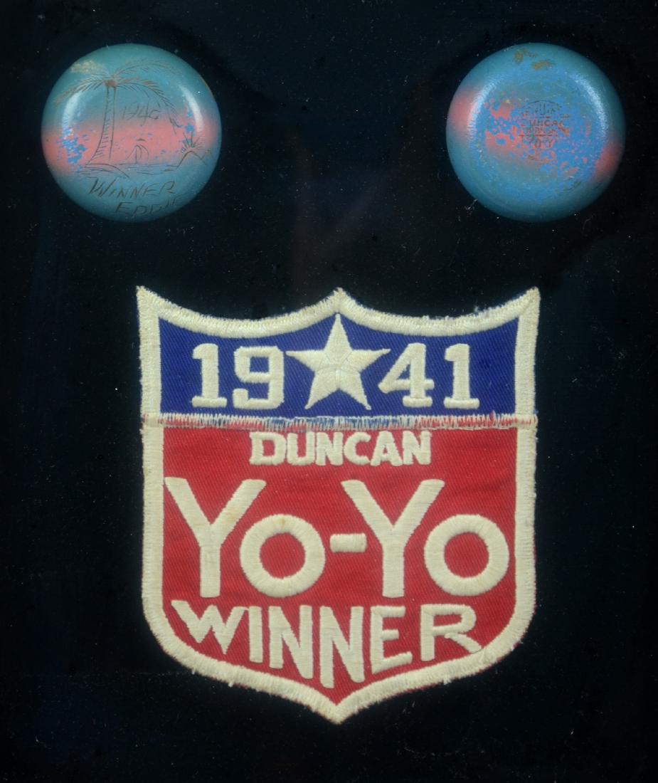 1941 Duncan Yo-Yo Winner Patch: Framed Duncan Yoyo Winner patch with yo-yo etched "1940 Winner Eddie", 13-1/4" x 11-1/4" overall