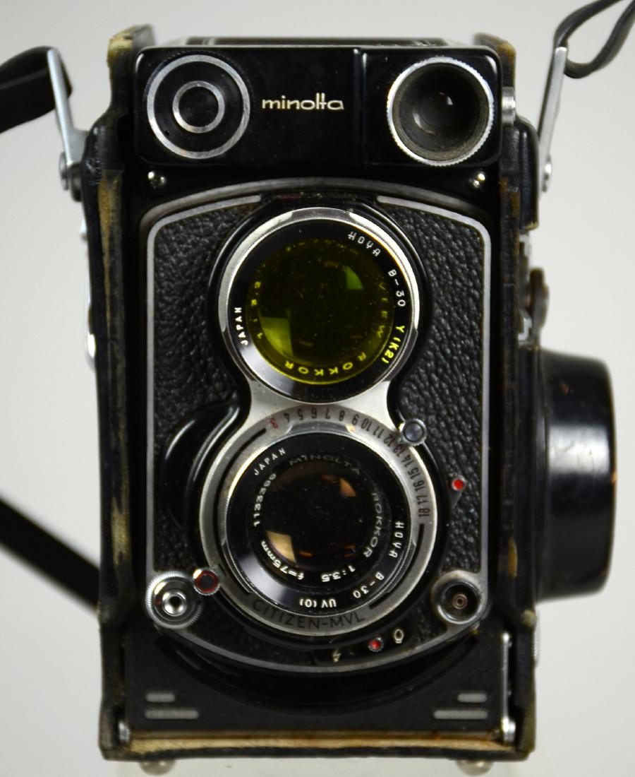Minolta Autocord Citizen MVL: Minolta Autocord Citizen MVL TLR 1:3.5 f=75mm with leather case and two lens filters. Missing focusing knob. 6-3/4"x4-1/2"x4"
