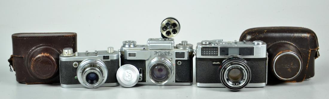 (3) Vintage Rangefinder Cameras, Minolta, Kiev, Diax: Kiev metered rangefinder, Soviet copy of German Contax, includes five optic turret zoom finder, shoots with a sticky shutter. 5-1/2"x5-3/4"x3" Diax compact rangefinder, first generation, German made, 