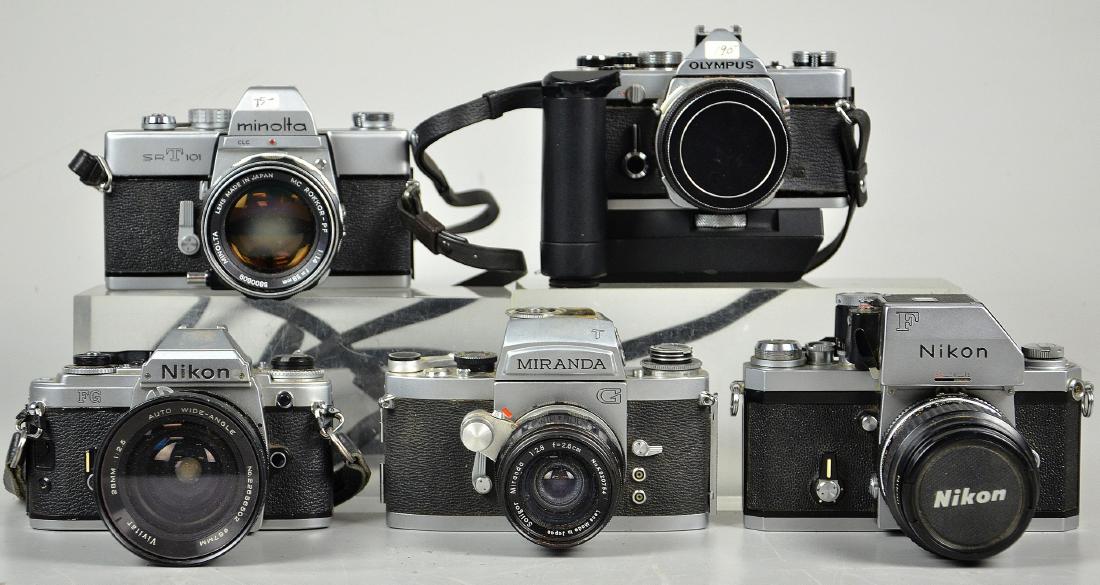 (5) Vintage SLR Cameras: Nikon F metered SLR camera with 55mm Nikkor Lens 1:2.8 shutter is sticky. Nikon FG metered SLR camera with 28mm Vivitar lens 1:2.5, shutter sticks but probably just needs a replacement battery. Mirand