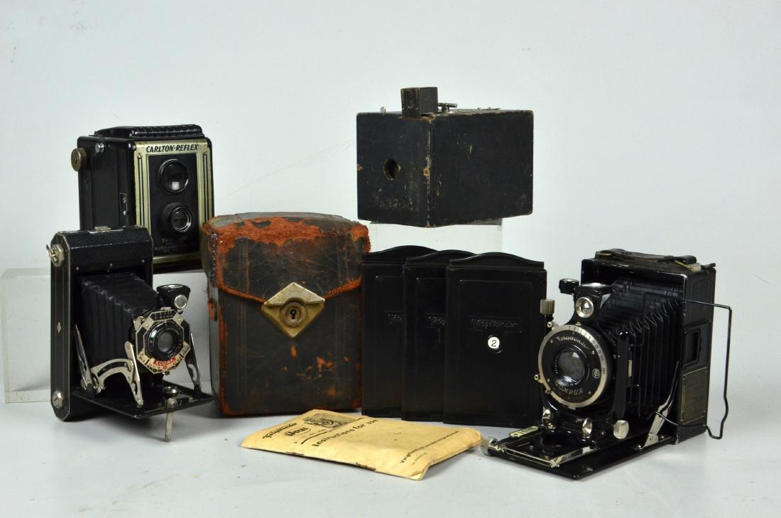 Voigtlander Large Format Camera, (3) Vintage Medium: Voigtlander Anastigmat..Skopar large format camera includes leather case 3 plates and lens filter 1:45 F=10.5. 6-1/2"x4-3/4"x3-1/2". Carlton-Reflex Twin Lens Box Camera, black Bakelite body and ground