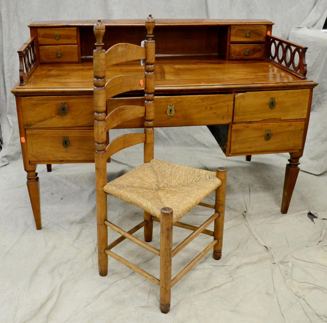 Mahogany French style executive desk w/ ladderback: Mahogany French style executive desk w/ ladderback chair, desk with inlaid drawer fronts, and side panels, one drawer flanked by two drawers on each side, ladderback chair with rush seat, desk 39" h x
