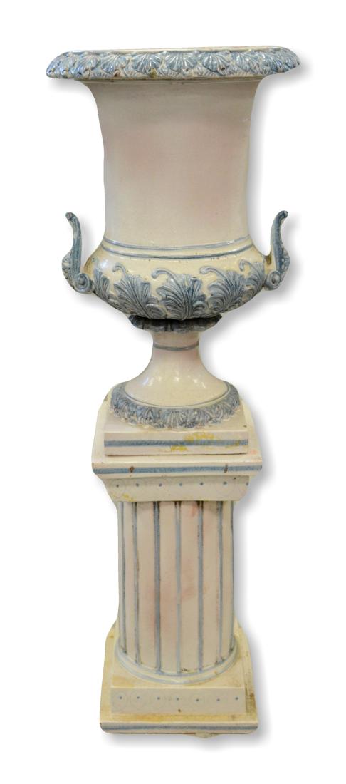 Blue & white 2 pc ceramic urn on pedestal: Blue & white 2 pc ceramic urn on pedestal, white crackled glaze finish with blue highlights, acanthus leaf decoration on urn edge, northwind face handles, columned base on two tiers, 54" h x 20" dia