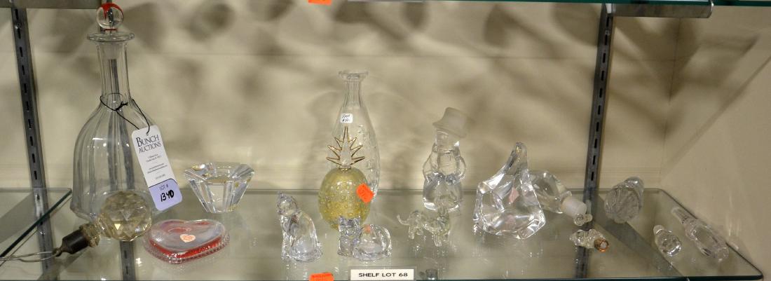 Shelf #68 - Glass and Crystal Bottles and Decor: Shelf #68 - Glass and crystal bottles and decor to include an unmarked decanter, gold foil accent perfume bottle, Orrefors candleholder, Webb Corbett bud vase, pr. cat figure salt/pepper shakers, dach
