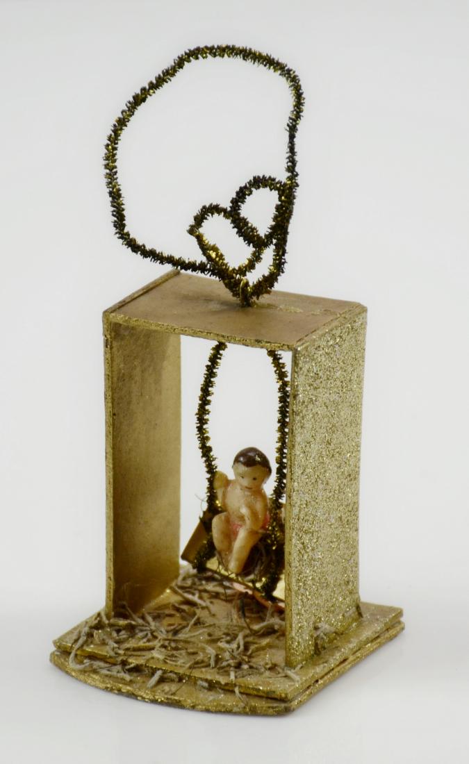 Swing with Baby Christmas Ornament: Swing with baby, wood and painted composition, possibly Sebritz, 3-1/4" h
