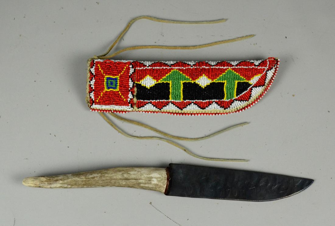 Early Native American Indian beaded knife sheath w: Early Native American Indian beaded knife sheath with vintage knife, beaded with black, white, red, yellow and green beads, 4 strands of fringe to bottom of sheath, unmarked with antler handle, 9- 3/4
