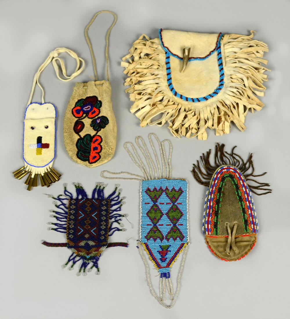 5 Native American Indian beaded pouchs & sheath: 5 Native American beaded pouchs & sheath. First, hide detailed with orange, red, and green beaded floral design, with drawstring top, 5-3/4" L. Second, soft hide with turquoise, black & red beadwork,