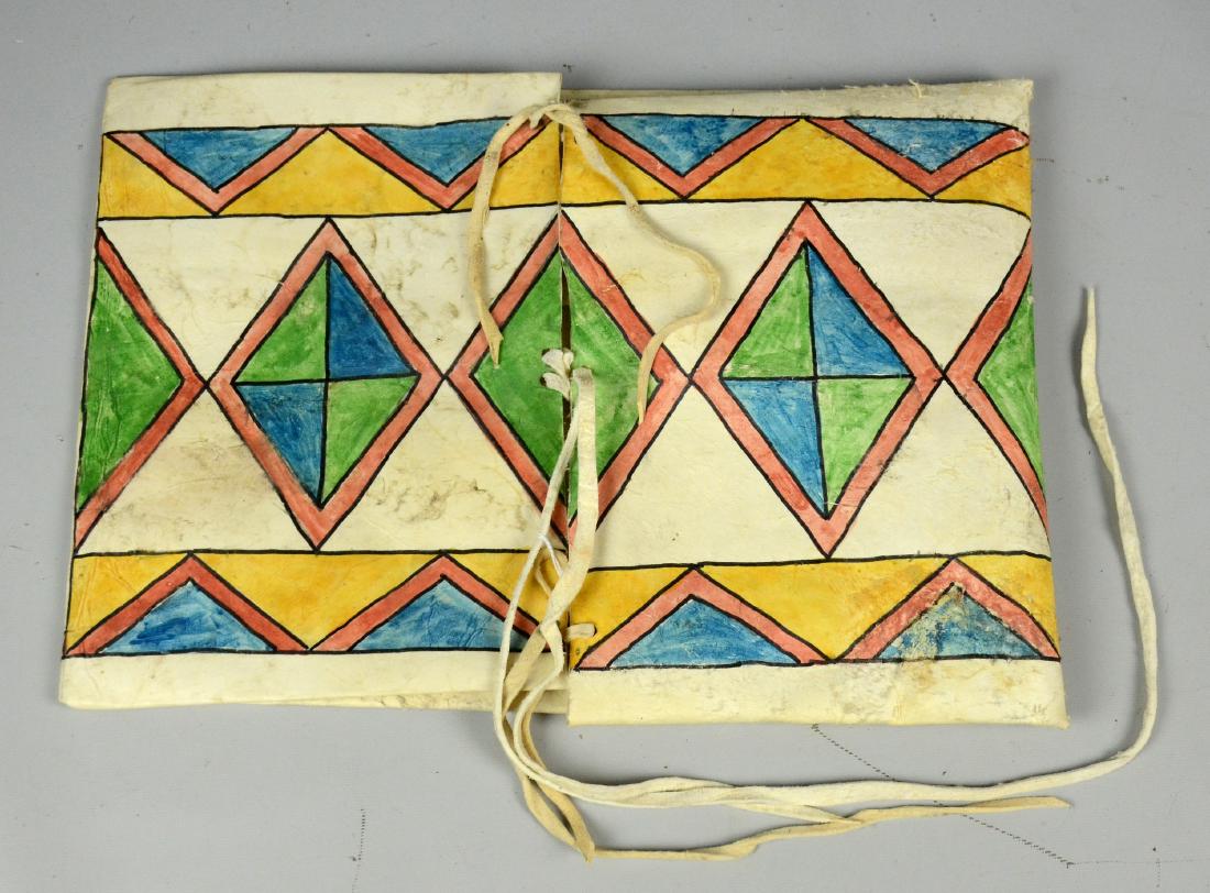 Native American Indian painted parfleche: Native American painted parfleche, rawhide, handmade, brightly painted with geometric designs, 14-1/2" L, 10-1/2" W while tied shut