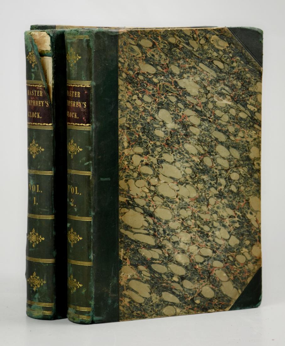 [1st Edition] Charles Dickens, Master Humphrey's Clock: [First Edition] Dickens, Charles, "Master Humphrey's Clock" (London, Chapman and Hall 1840); 3 vols in 2; contemporary half green sheep over marbled boards (one crown damaged, rear panel of Vol 1 deta