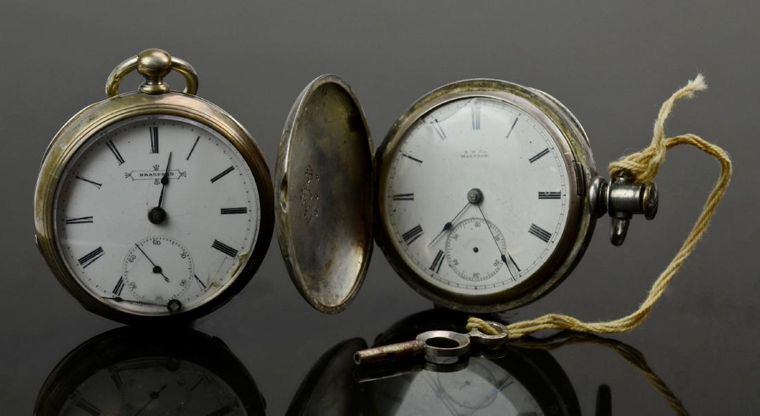 (2) 18s Coin Silver American Pocket Watches: (2) 18s coin silver American pocket watches, run when wound, Waltham William Ellery, needs seconds hand; SN 1343881, Bradford Watch Co, clear hinged front cover, SN 94591 no warranty intended