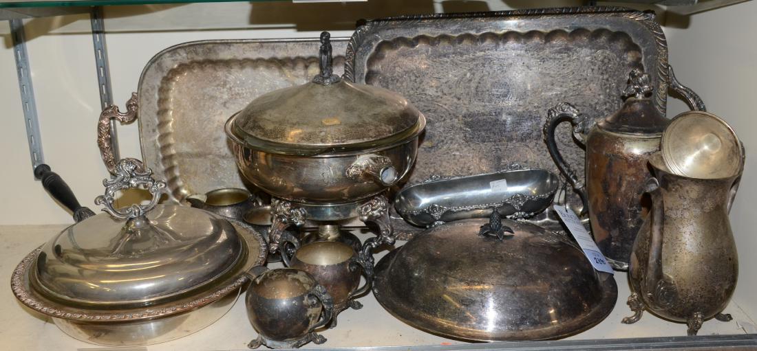 Shelf #90 - Silverplate Serveware: Shelf # 90 - Silverplate serveware c/o: lidded pan with glass insert and burner stand, lidded pan with divided Pyrex glass insert, covered round platter, (2) creamers, (2) sugars, (2) coffee pots, (2)