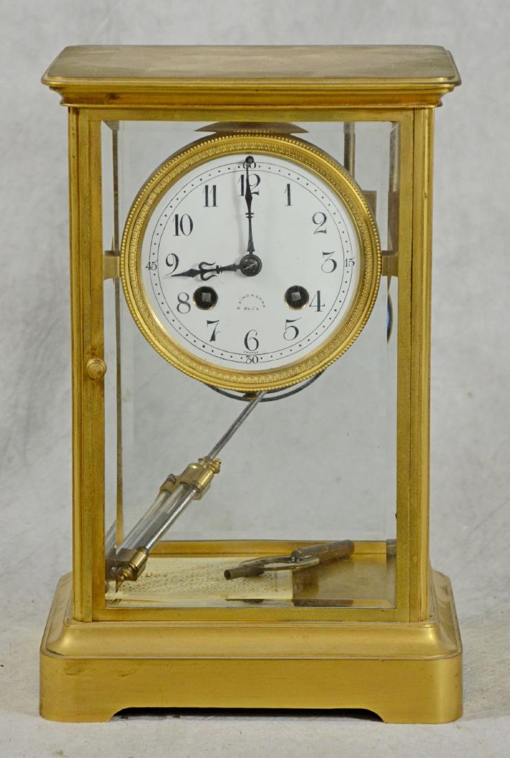 French crystal regulator clock in brass case: French crystal regulator clock in brass case, c. 1900, white porcelain dial marked "S. Kind & Sons, Phil'a", 8 day, time and strike, spring driven movement, compensated pendulum, good condition