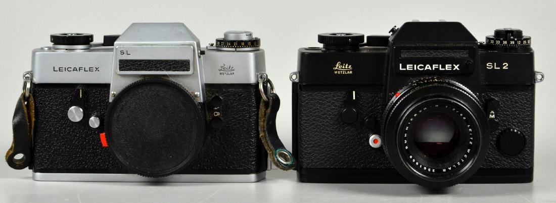 (2) Leicaflex SLR 35mm Cameras: Leicaflex SL and Leicaflex SL2. 2 Leica brand SLR 35mm cameras and one Leitz Wetzlar Summicron-R 1:2 / 50mm lens. Both cameras in very good condition, shutters fire properly. 5-3/4"x4"x1-1/2"