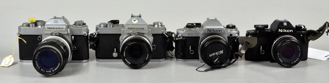 (4) Nikon SLR 35mm Cameras: Nikon EM 35mm SLR camera with aperture priority, Nikon Lens Series E 50mm 1:1.8. Nikkormat FT2 35mm SLR camera with Nikkor 50mm 1:2 lens. Nikon FG 35mm SLR camera with Nikon Lens Series E 50mm 1:1.8.