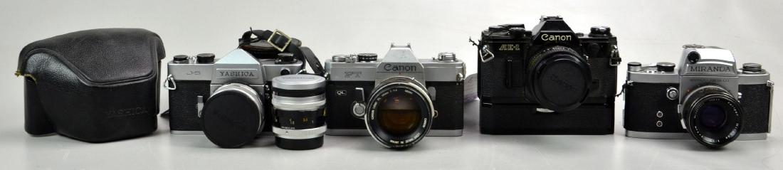 (4) Vintage 35mm SLR Cameras: Canon AE-1 35mm SLR Camera with 28mm 1:2.8 FD lens and Canon Power Winder A. Miranda Camera Co 35mm SLR camera with light meter prism and Soligor 1:1.9 f=5cm lens. Canon FT QL 35mm SLR camera with 55m