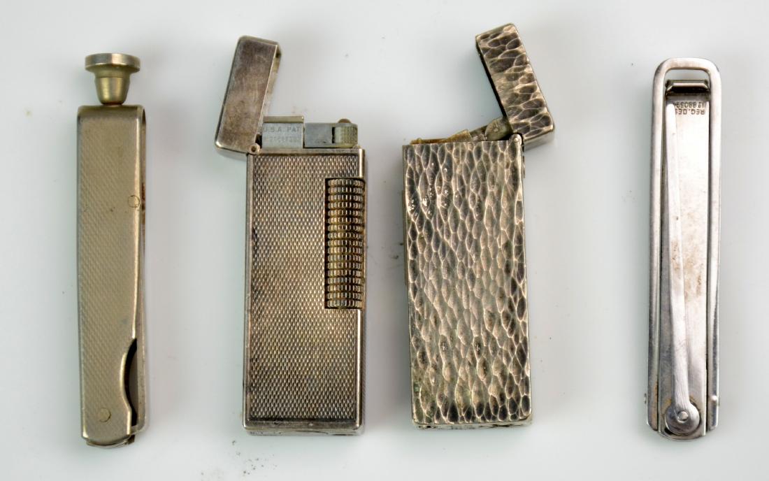 (2) Lighters and (2) Pipe Tools: (1) Dunhill Rollagas Lighter (Pat RE24163), (1) Zenith Rollalite Subaru Lighter, (2) Dunhill Pipe Tools