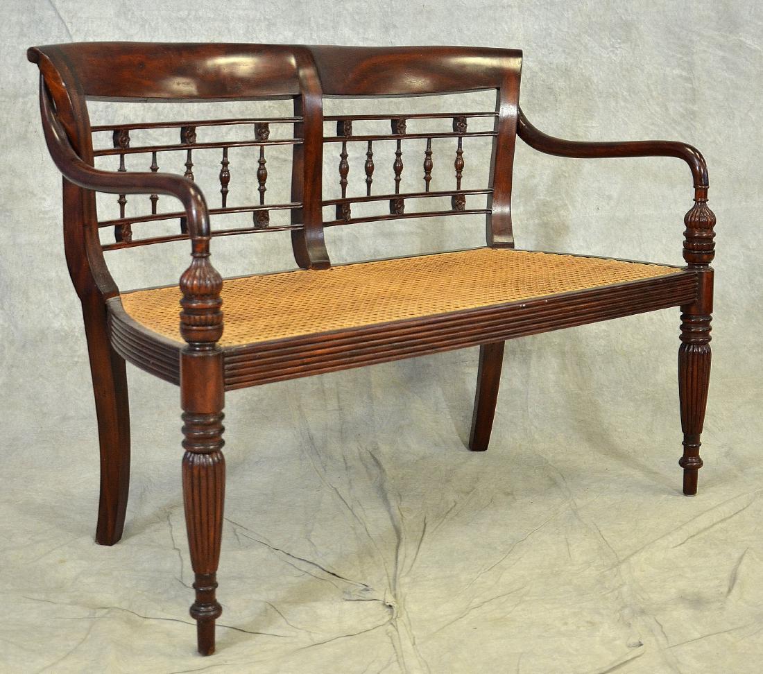 Mahogany Sheraton style caned bench: Mahogany Sheraton style caned bench, two seat with pierced back, caned seat, turned and reeded legs, 35"h x 48"w x 21"d, less than 30 years old, made in Indonesia, excellent condition, with tag "Furni