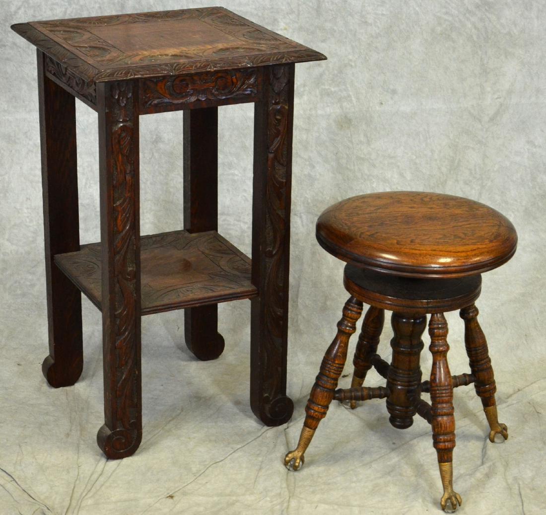 Oak carved lamp table, oak piano stool: Oak carved lamp table, oak piano stool, table with carved floral decoration and acanthus leaves, lower shelf, stool with swivel seat, turned legs over ball and claw feet, table 30-1/2"h x 18"square