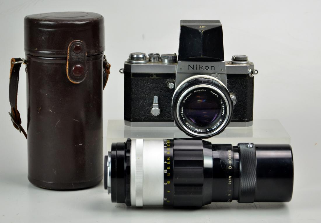 (2) Nikon F1 with 2 lenses: Nikon F1 with eye level viewfinder, Nikkor-S 1:1.4 f=5.8cm lens and Nikkor-Q 1:4 f=200mm zoom lens. Lenses are clean and clear, camera shoots as expected, zoom lens includes leather case. 7 1/2"x3 1/2