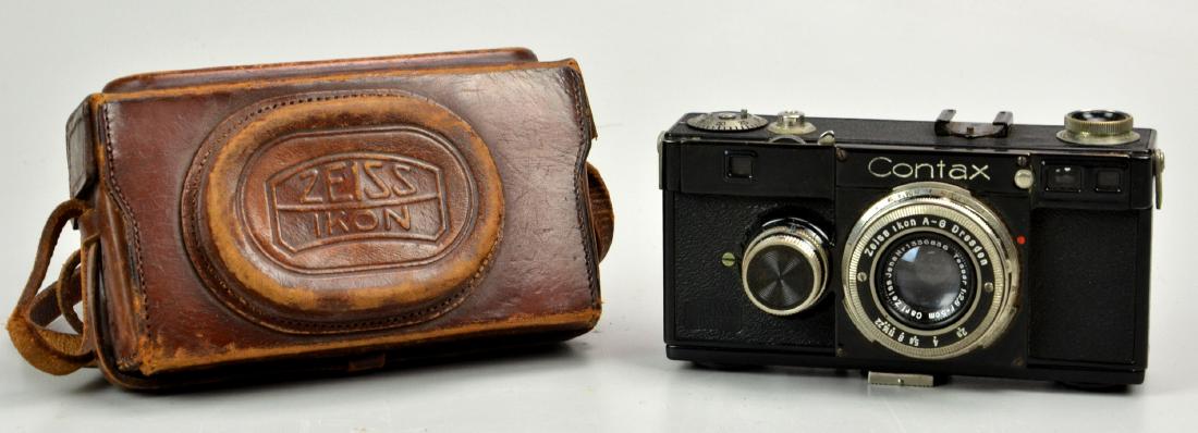Zeiss Ikon Contax Ia Rangefinder Camera: Contax Ia 35mm rangefinder camera, serial number: U20100 manufactured 1932/33. Zeiss Jena Tessar 1:2.8 F=5cm with original leather case. Shutter does not function.