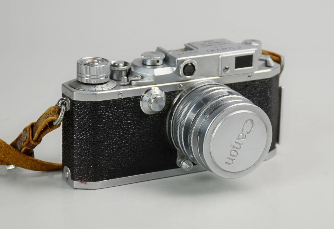 Canon IIF 35mm Rangefinder: Canon IIF 35mm rangefinder with 50mm f:1.8 lens, serial number 155768, manufactured 1953. In great condition, free of haze, fungus, corrosion, or any damage to leather. Shutter fires but is sticky bel