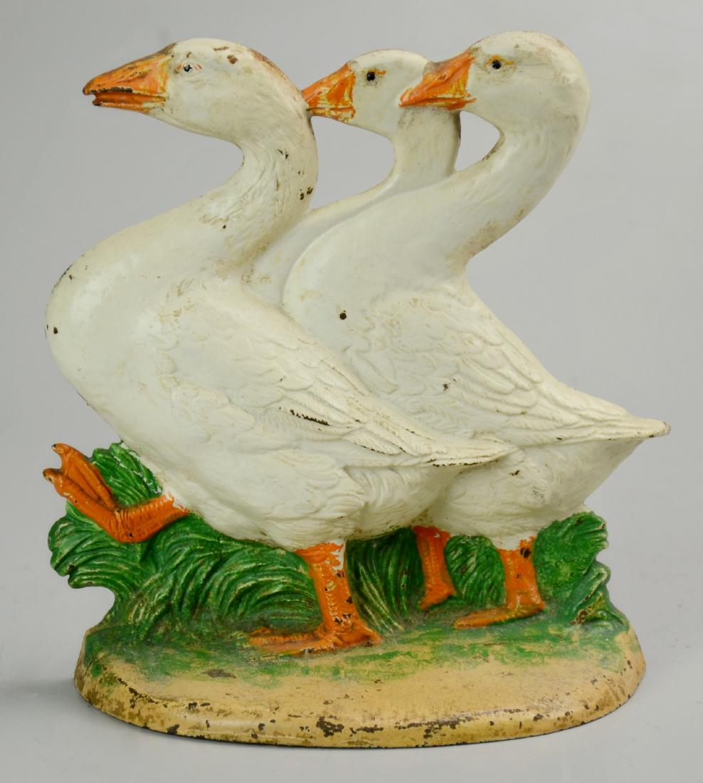 Cast Iron Three Geese Doorstop: Cast iron Three Geese doorstop, 8" h x 8" w, some paint wear & rust