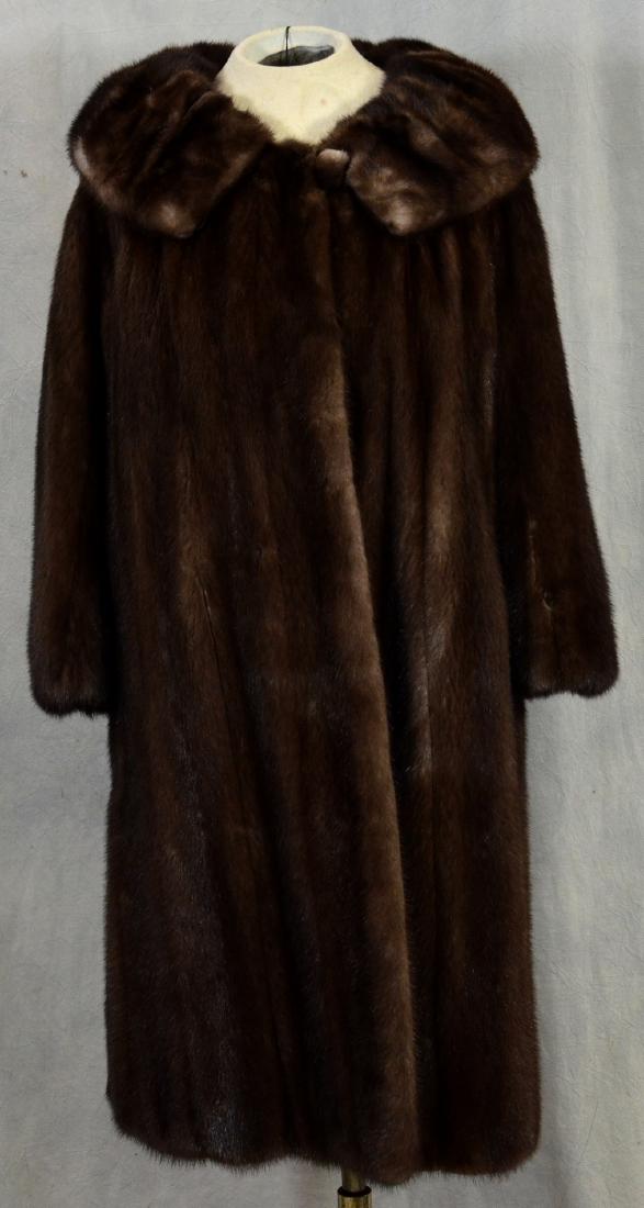 Mink Coat with Over-Sized Mink Collar: Satin Lined Mink Coat with Over-sized Collar and Fur Covered Button Closure at Neck. Tear at left wrist running vertically, about 3" long with two smaller tears surrounding.