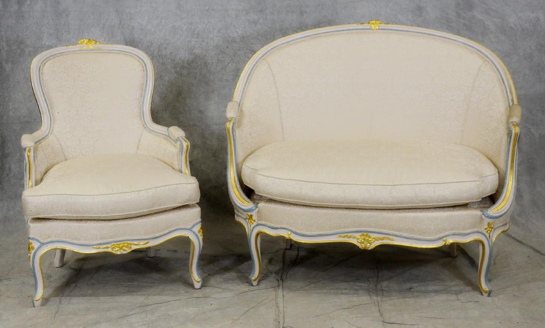 (2) pc Louis XV style distressed cream painted parlor: (2) pc Louis XV style distressed cream painted parlor set, c/o distressed cream painted settee with blue and gilt highlights, cream floral upholstery, scrolled cabriolet legs, armchair with distressed