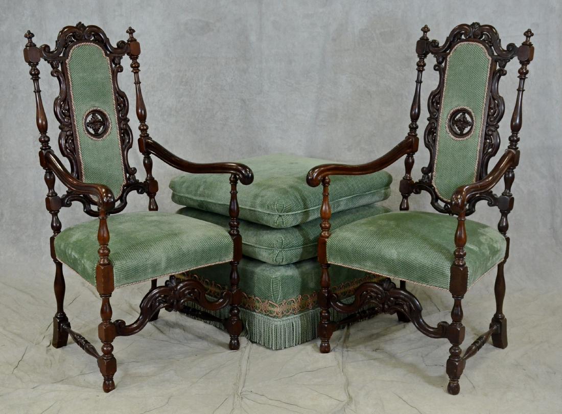 Pair Rococo style walnut carved armchairs, along with a: Pair Rococo style walnut carved armchairs, along with a stacked ottoman, scrolled carved decoration, scrolled arms green upholstery, turned and block sides and legs, armchairs 50"h, seat height 19-1/2